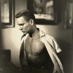 Photograph by George Platt Lynes: [Chuck Howard in Profile, Looking Down], available at Childs Gallery, Boston