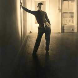 Photograph by George Platt Lynes: [Chuck Howard Leaning Against Wall], available at Childs Gallery, Boston