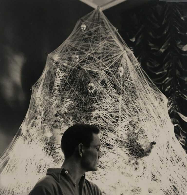 Photograph by George Platt Lynes: [Chuck Howard Posing Among an Adorned Tree II], available at Childs Gallery, Boston