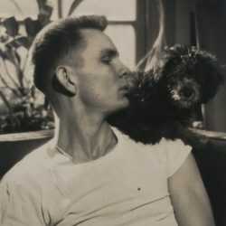 Photograph by George Platt Lynes: [Chuck Howard with Dog], available at Childs Gallery, Boston